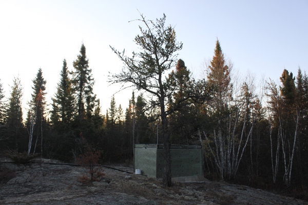 Seismic instruments in a protective shelter located in the woods